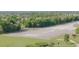 Aerial view of private airstrip surrounded by lush green landscape at 2051 Cornell Pl, Port Orange, FL 32128