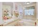 Bathroom boasts a bathtub, shower, and granite countertops at 2051 Cornell Pl, Port Orange, FL 32128