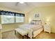 Bright bedroom featuring a white bed frame and window seat at 2051 Cornell Pl, Port Orange, FL 32128