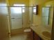 Bathroom featuring a shower/tub combination with sliding glass doors and vanity with large mirror at 714 Fox Tail Ct, New Smyrna Beach, FL 32168