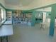 Community clubhouse with bookshelves along the wall at 714 Fox Tail Ct, New Smyrna Beach, FL 32168