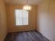 Dining room with wood floors, large window, and decorative chandelier at 714 Fox Tail Ct, New Smyrna Beach, FL 32168