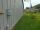 Exterior shot of the home's siding showing the adjacent lawn at 714 Fox Tail Ct, New Smyrna Beach, FL 32168