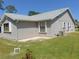 Charming home featuring a well-maintained lawn and gray exterior siding and white trim at 714 Fox Tail Ct, New Smyrna Beach, FL 32168