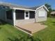 Elevated patio with screened porch and house at 714 Fox Tail Ct, New Smyrna Beach, FL 32168