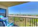 Inviting balcony view with seating offering a serene ocean backdrop, and overlooking the beach at 3180 Ocean Shore Blvd # 208, Ormond Beach, FL 32176