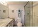 Clean bathroom with a shower, toilet, and vanity, featuring a functional and well-maintained space at 3180 Ocean Shore Blvd # 208, Ormond Beach, FL 32176