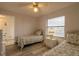 Bright bedroom with twin beds, wood floors, and a window, offering a cozy and inviting space at 3180 Ocean Shore Blvd # 208, Ormond Beach, FL 32176