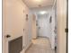 Clean hallway featuring tile floors with easy access to a bedroom and closet at 3180 Ocean Shore Blvd # 208, Ormond Beach, FL 32176