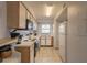 Well-lit kitchen featuring classic appliances, practical design, and ample counter space at 3180 Ocean Shore Blvd # 208, Ormond Beach, FL 32176