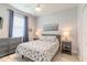 Inviting bedroom with soothing color palette, light-colored flooring and beach-themed bedding at 3365 Meleto Blvd, New Smyrna Beach, FL 32168