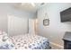 Comfortable bedroom with a closet and TV, perfect for relaxation at 3365 Meleto Blvd, New Smyrna Beach, FL 32168
