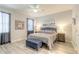 Charming bedroom featuring light-colored flooring, ceiling fan, and beach-themed decor at 3365 Meleto Blvd, New Smyrna Beach, FL 32168
