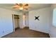 Simple bedroom with carpet, a ceiling fan, and a closet for storage solutions at 1119 Edith Dr, Daytona Beach, FL 32117