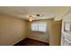 Bedroom with carpet flooring, ceiling fan, window, and neutral colored walls at 1119 Edith Dr, Daytona Beach, FL 32117