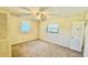 Well-lit bedroom features carpet flooring, a ceiling fan, and a window at 1119 Edith Dr, Daytona Beach, FL 32117