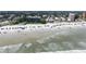 Aerial shot of a sandy beach with parking and condo buildings, and ocean views at 320 Due East St, New Smyrna Beach, FL 32169