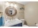 Updated bathroom with a rustic mirror and marble vanity at 3509 S Atlantic Ave # 400, New Smyrna Beach, FL 32169