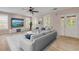 Bright living room with comfy seating and large TV at 636 Glen Cir, New Smyrna Beach, FL 32168