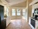 Well-lit kitchen featuring black appliances, and a cozy breakfast nook with large windows for ample natural light at 101 Braeburn Cir, Daytona Beach, FL 32114