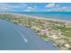 Aerial view of waterfront homes and beach at 1194 N Peninsula Ave, New Smyrna Beach, FL 32169