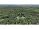 An aerial shot of a home encircled by dense forest, offering seclusion and natural beauty at 2536 Paige Ave, New Smyrna Beach, FL 32168