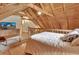 Upstairs bedroom featuring natural light and vaulted wood ceiling at 2536 Paige Ave, New Smyrna Beach, FL 32168