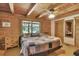 Cozy bedroom featuring wood-paneled walls, vaulted ceiling, and closet at 2536 Paige Ave, New Smyrna Beach, FL 32168