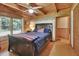 Bedroom with wood ceiling and trim, light walls, and a ceiling fan for added comfort at 2536 Paige Ave, New Smyrna Beach, FL 32168