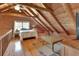 Second story bedroom with wooden ceiling and telescope at 2536 Paige Ave, New Smyrna Beach, FL 32168