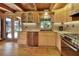 Well-lit kitchen featuring granite countertops, wooden cabinets, and stainless steel appliances at 2536 Paige Ave, New Smyrna Beach, FL 32168