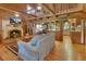 Cozy log cabin with a stone fireplace, hardwood floors, and an open floor plan at 2536 Paige Ave, New Smyrna Beach, FL 32168