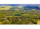 Aerial view showing home's location on a wooded lot at 4660 Holly Rd, New Smyrna Beach, FL 32168