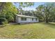 Newly renovated home with metal roof and spacious yard at 4660 Holly Rd, New Smyrna Beach, FL 32168