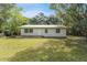 Ranch style home with metal roof and spacious yard at 4660 Holly Rd, New Smyrna Beach, FL 32168