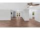 Open living space with wood floors and access to kitchen at 4660 Holly Rd, New Smyrna Beach, FL 32168