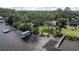 Waterfront property from above with its own dock and beautifully landscaped grounds at 1949 Bayview Dr, New Smyrna Beach, FL 32168