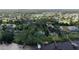 A high angle of the waterfront property, displaying its private dock and lush greenery at 1949 Bayview Dr, New Smyrna Beach, FL 32168