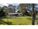 Enjoy the backyard and patio with its built-in grill and enclosed porch at 1949 Bayview Dr, New Smyrna Beach, FL 32168