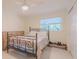 Modest bedroom includes an exterior-view window at 1949 Bayview Dr, New Smyrna Beach, FL 32168