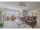 Cozy living room featuring a decorative fireplace, comfortable seating, and ample natural light at 1949 Bayview Dr, New Smyrna Beach, FL 32168