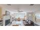 Comfortable living room with a fireplace, built-in shelves, and a cozy seating area at 1949 Bayview Dr, New Smyrna Beach, FL 32168