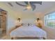 A lovely main bedroom with nice coastal decor and ceiling fan at 1949 Bayview Dr, New Smyrna Beach, FL 32168