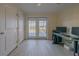 Office featuring a desk and doors that lead to the backyard at 1949 Bayview Dr, New Smyrna Beach, FL 32168