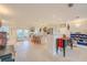 Bright, open-concept living space with kitchen, dining, and living areas seamlessly connected at 1949 Bayview Dr, New Smyrna Beach, FL 32168