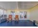 Covered porch with room for chairs, offering a relaxing space to enjoy the outdoors at 1949 Bayview Dr, New Smyrna Beach, FL 32168