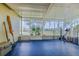Enjoy the outdoors from this enclosed porch, complete with a view and space for exercise at 1949 Bayview Dr, New Smyrna Beach, FL 32168