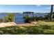 Picturesque waterfront view with a charming gazebo on the water's edge, perfect for relaxing and enjoying the scenery at 1949 Bayview Dr, New Smyrna Beach, FL 32168