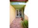 Inviting entryway with tiled flooring, and landscaped planter at 219 Club House Blvd, New Smyrna Beach, FL 32168