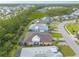 Community aerial view showcasing beautiful homes, landscaping, and nearby wetlands at 306 Coral Reef Way, Daytona Beach, FL 32124